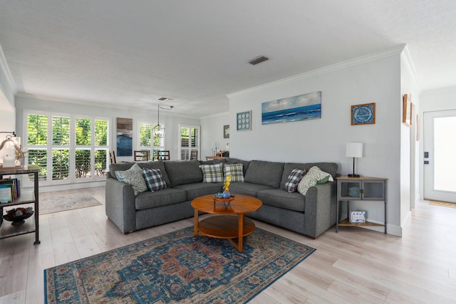 2948 SE Treasure Island Rd, Port Saint Lucie, FL 34952 - living room with crown molding, light wood finished floors, and baseboards