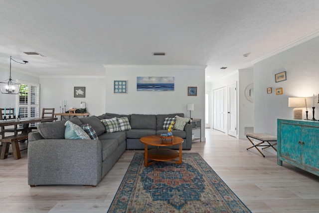 2948 SE Treasure Island Rd, Port Saint Lucie, FL 34952 - living room with ornamental molding, light wood-type flooring, and a chandelier