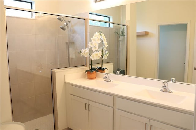 1095 N Verona Trace Dr, Vero Beach, FL 32966 - full bathroom with a stall shower, double vanity, healthy amount of natural light, and toilet