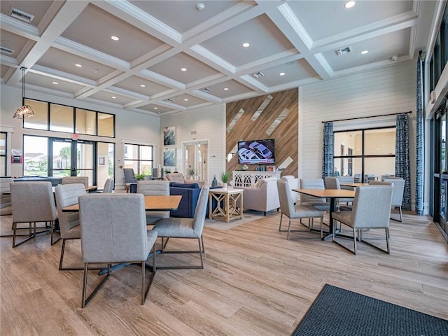 1095 N Verona Trace Dr, Vero Beach, FL 32966 - dining room with a high ceiling, coffered ceiling, wood walls, light wood finished floors, and beam ceiling