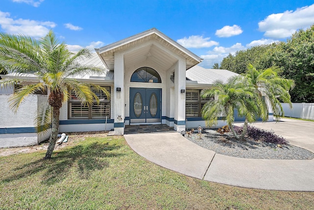 407 SE Duff Ct, Port Saint Lucie, FL 34984 - view of exterior entry with concrete driveway