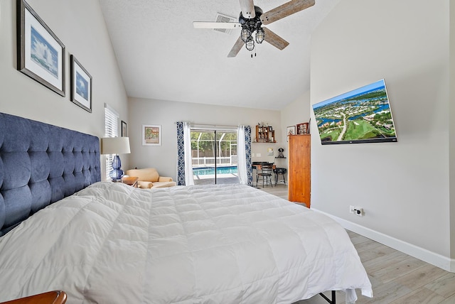 407 SE Duff Ct, Port Saint Lucie, FL 34984 - bedroom with access to exterior, light wood-style floors, high vaulted ceiling, a ceiling fan, and baseboards