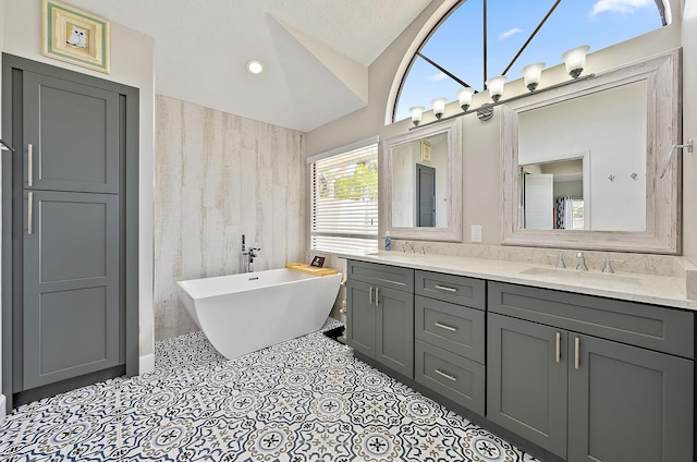 407 SE Duff Ct, Port Saint Lucie, FL 34984 - full bath with double vanity, a soaking tub, and lofted ceiling