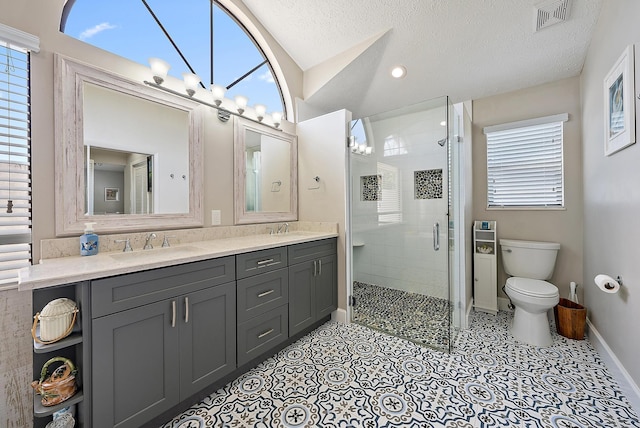 407 SE Duff Ct, Port Saint Lucie, FL 34984 - full bath featuring double vanity, a stall shower, toilet, baseboards, and a chandelier