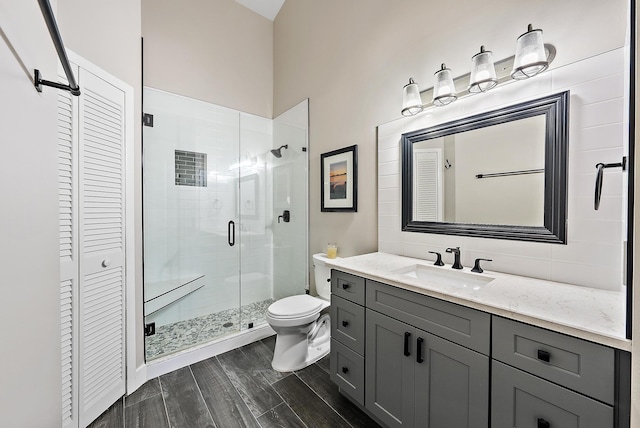 407 SE Duff Ct, Port Saint Lucie, FL 34984 - full bathroom with a closet, a stall shower, vanity, and toilet