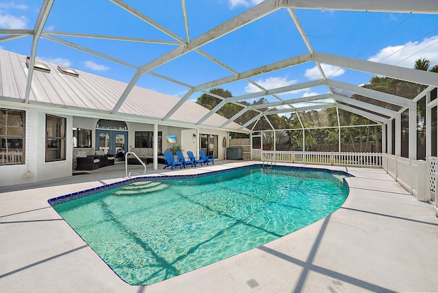 407 SE Duff Ct, Port Saint Lucie, FL 34984 - swimming pool with a patio area and glass enclosure