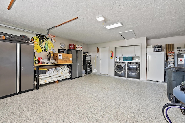 407 SE Duff Ct, Port Saint Lucie, FL 34984 - garage with washer and clothes dryer and freestanding refrigerator