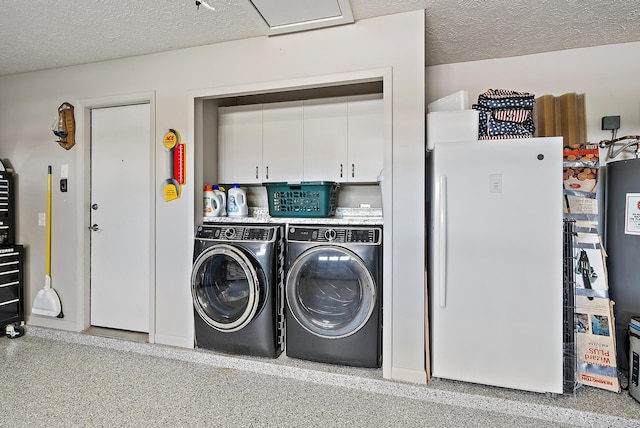407 SE Duff Ct, Port Saint Lucie, FL 34984 - washroom featuring washing machine and dryer, a textured ceiling, and cabinet space