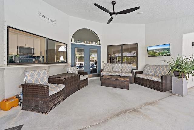 407 SE Duff Ct, Port Saint Lucie, FL 34984 - living area featuring ceiling fan, french doors, and a textured ceiling