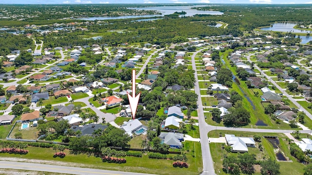 407 SE Duff Ct, Port Saint Lucie, FL 34984 - aerial overview of property's location with a large body of water and nearby suburban area