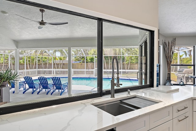 407 SE Duff Ct, Port Saint Lucie, FL 34984 - view of swimming pool with a sink, a ceiling fan, and area for grilling