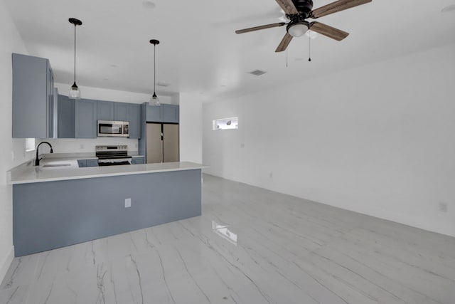 2921 Saginaw Ave Unit 1, West Palm Beach, FL 33417 - kitchen featuring range with electric stovetop, stainless steel microwave, a peninsula, and light countertops