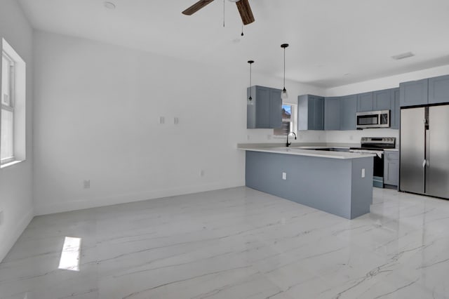2921 Saginaw Ave Unit 1, West Palm Beach, FL 33417 - kitchen featuring stainless steel appliances, light marble finish floors, a peninsula, ceiling fan, and light countertops