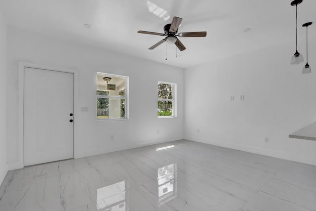 2921 Saginaw Ave Unit 1, West Palm Beach, FL 33417 - spare room with marble finish flooring and ceiling fan