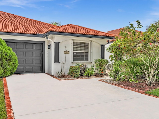 18458 Via Di Sorrento, Boca Raton, FL 33496 - mediterranean / spanish house with a garage, concrete driveway, a tile roof, and stucco siding