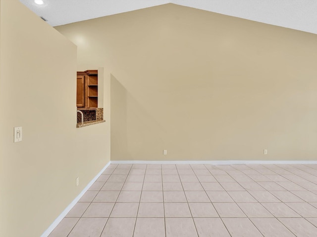 18458 Via Di Sorrento, Boca Raton, FL 33496 - spare room with lofted ceiling and baseboards