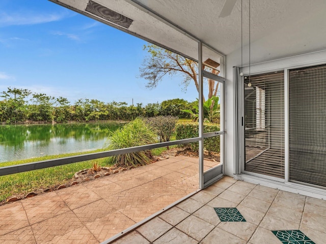 18458 Via Di Sorrento, Boca Raton, FL 33496 - unfurnished sunroom with a water view and a ceiling fan