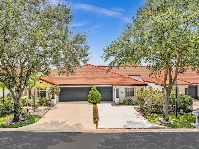 18458 Via Di Sorrento, Boca Raton, FL 33496 - mediterranean / spanish-style home featuring a tiled roof, a garage, concrete driveway, and stucco siding