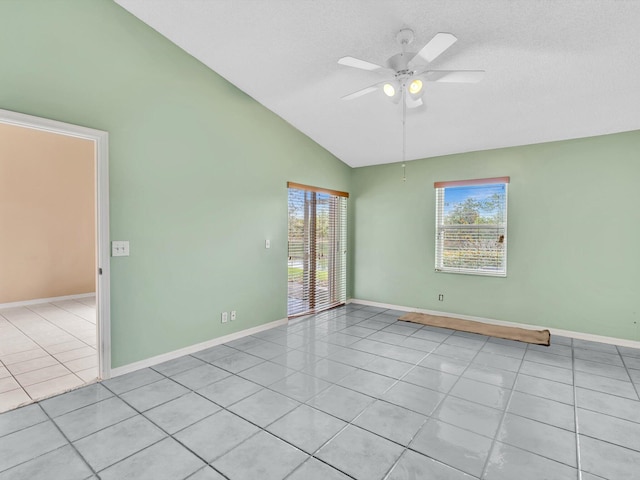 18458 Via Di Sorrento, Boca Raton, FL 33496 - empty room with light tile patterned flooring, lofted ceiling, a ceiling fan, baseboards, and a textured ceiling