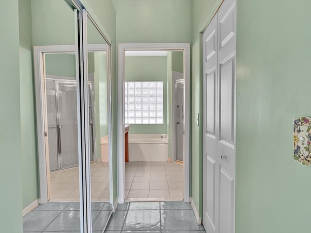 18458 Via Di Sorrento, Boca Raton, FL 33496 - corridor with tile patterned flooring and baseboards