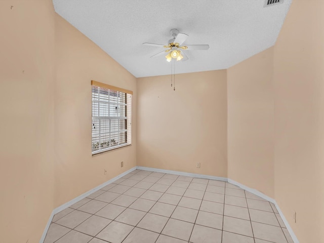 18458 Via Di Sorrento, Boca Raton, FL 33496 - spare room featuring a ceiling fan, lofted ceiling, baseboards, light tile patterned floors, and a textured ceiling