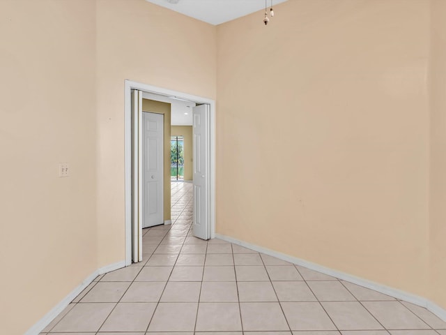 18458 Via Di Sorrento, Boca Raton, FL 33496 - empty room with light tile patterned flooring and baseboards