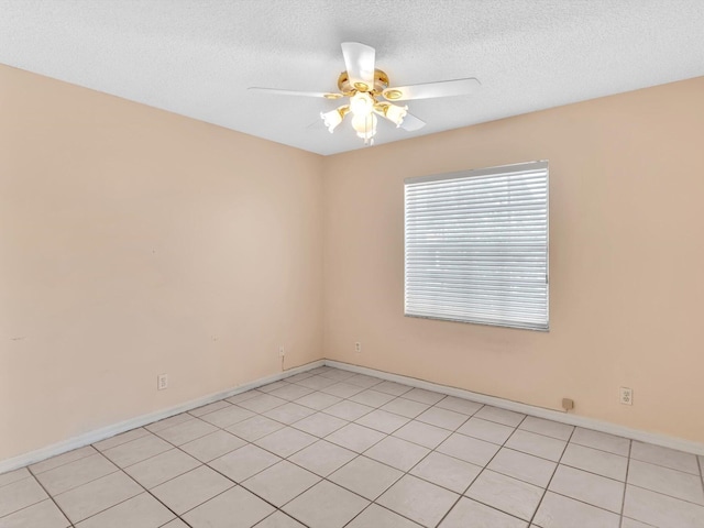 18458 Via Di Sorrento, Boca Raton, FL 33496 - unfurnished room featuring ceiling fan, a textured ceiling, baseboards, and light tile patterned flooring