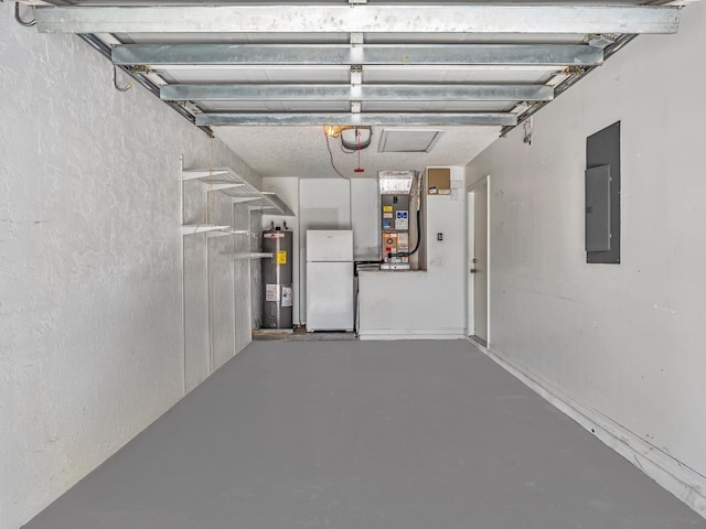 18458 Via Di Sorrento, Boca Raton, FL 33496 - garage with freestanding refrigerator, electric water heater, electric panel, and heating unit