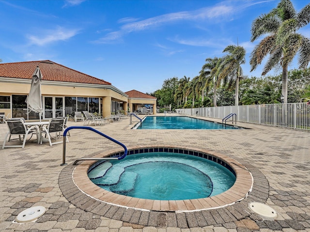 18458 Via Di Sorrento, Boca Raton, FL 33496 - community pool featuring a hot tub and a patio