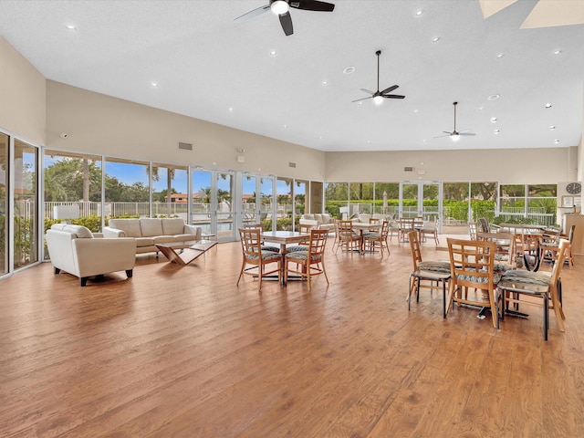 18458 Via Di Sorrento, Boca Raton, FL 33496 - dining space featuring ceiling fan, recessed lighting, light wood finished floors, and a skylight