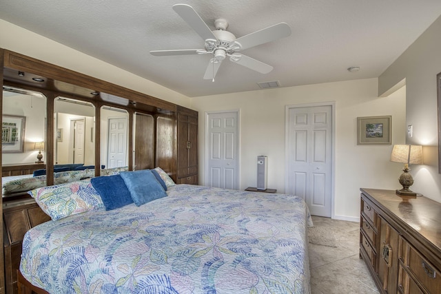 188 Wandering Trl, Jupiter, FL 33458 - bedroom featuring multiple closets, a ceiling fan, and baseboards