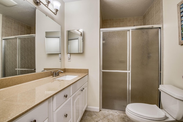 188 Wandering Trl, Jupiter, FL 33458 - full bathroom featuring toilet, a textured ceiling, vanity, a stall shower, and tile patterned floors