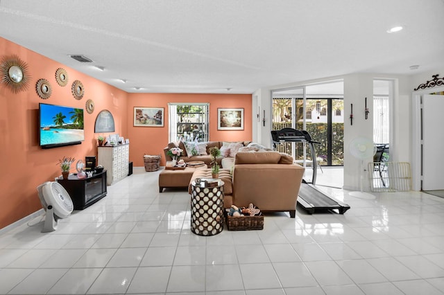 5196 Europa Dr Unit D, Boynton Beach, FL 33437 - living room with light tile patterned floors and recessed lighting