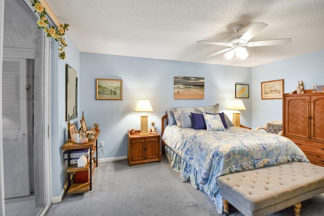 5196 Europa Dr Unit D, Boynton Beach, FL 33437 - carpeted bedroom with baseboards, a textured ceiling, and ceiling fan