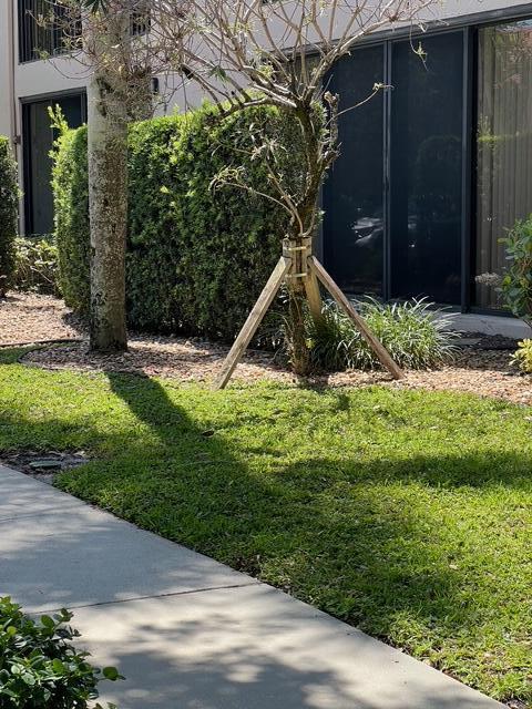 5196 Europa Dr Unit D, Boynton Beach, FL 33437 - view of grassy yard