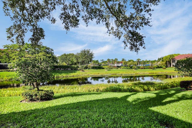 5196 Europa Dr Unit D, Boynton Beach, FL 33437 - view of green lawn featuring a water view