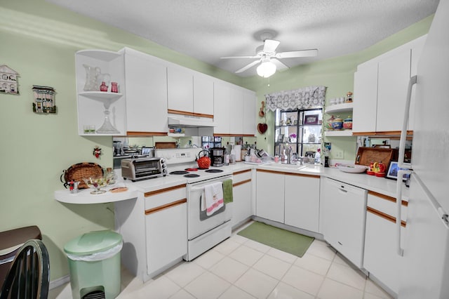 5196 Europa Dr Unit D, Boynton Beach, FL 33437 - kitchen featuring open shelves, white appliances, under cabinet range hood, white cabinets, and a textured ceiling