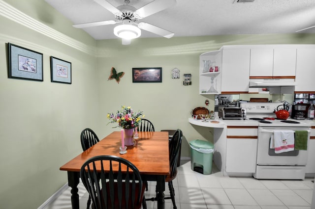 5196 Europa Dr Unit D, Boynton Beach, FL 33437 - kitchen featuring white electric range oven, white cabinets, under cabinet range hood, light countertops, and a ceiling fan