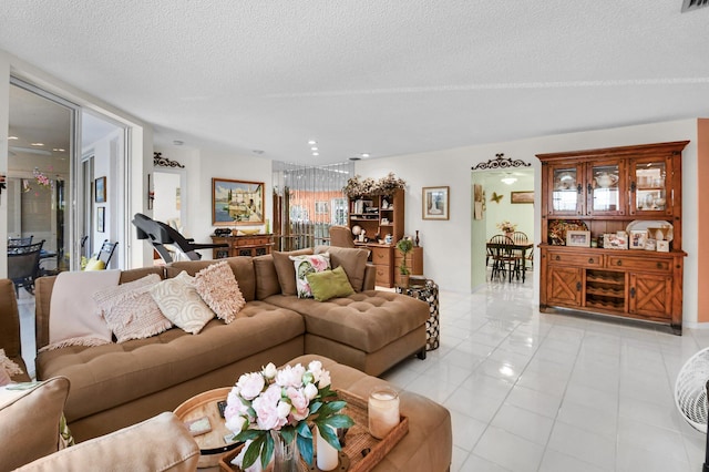 5196 Europa Dr Unit D, Boynton Beach, FL 33437 - living area with a textured ceiling and light tile patterned flooring