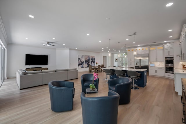 1770 Flagler Manor Cir, West Palm Beach, FL 33411 - living area with recessed lighting, light wood-type flooring, ornamental molding, and ceiling fan