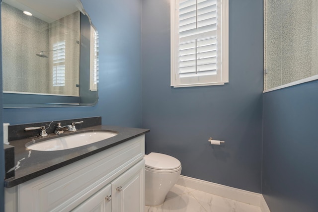 1770 Flagler Manor Cir, West Palm Beach, FL 33411 - bathroom with marble finish floors, toilet, vanity, baseboards, and a shower