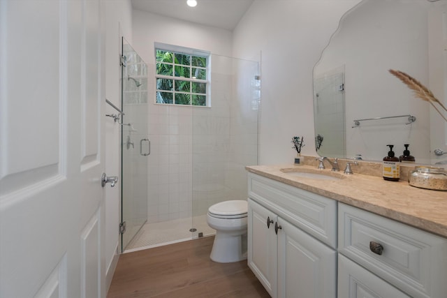 1770 Flagler Manor Cir, West Palm Beach, FL 33411 - full bathroom with toilet, a shower stall, vanity, wood finished floors, and recessed lighting