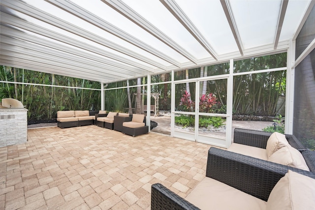 1770 Flagler Manor Cir, West Palm Beach, FL 33411 - sunroom / solarium with outdoor lounge area and an outdoor kitchen