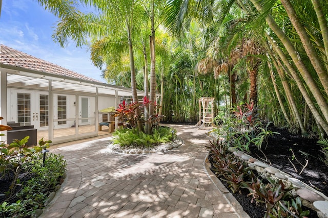 1770 Flagler Manor Cir, West Palm Beach, FL 33411 - view of patio / terrace featuring french doors