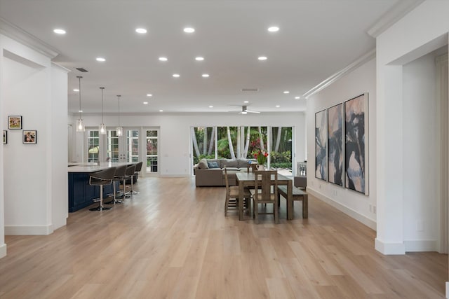 1770 Flagler Manor Cir, West Palm Beach, FL 33411 - dining space featuring baseboards, recessed lighting, crown molding, light wood-type flooring, and a ceiling fan