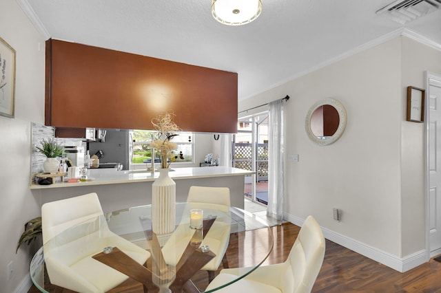3110 Kingston Ct, West Palm Beach, FL 33409 - dining space with ornamental molding, baseboards, and wood finished floors