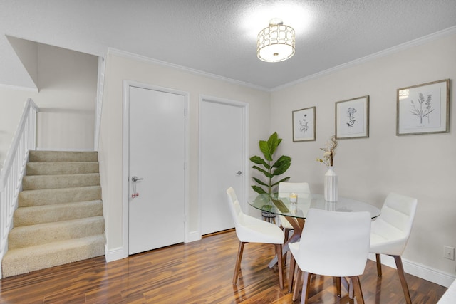 3110 Kingston Ct, West Palm Beach, FL 33409 - dining room featuring stairs, a textured ceiling, wood finished floors, ornamental molding, and baseboards