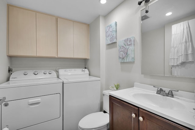 3110 Kingston Ct, West Palm Beach, FL 33409 - half bathroom with washer and dryer, toilet, vanity, and recessed lighting