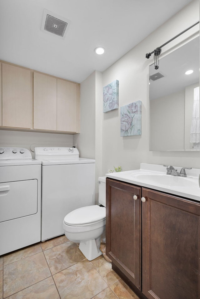 3110 Kingston Ct, West Palm Beach, FL 33409 - bathroom with washer and dryer, vanity, and toilet