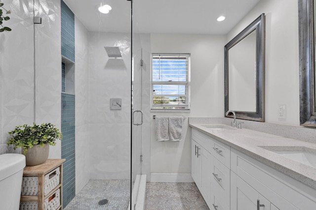 3110 Kingston Ct, West Palm Beach, FL 33409 - bathroom featuring a stall shower, double vanity, tile patterned flooring, and recessed lighting